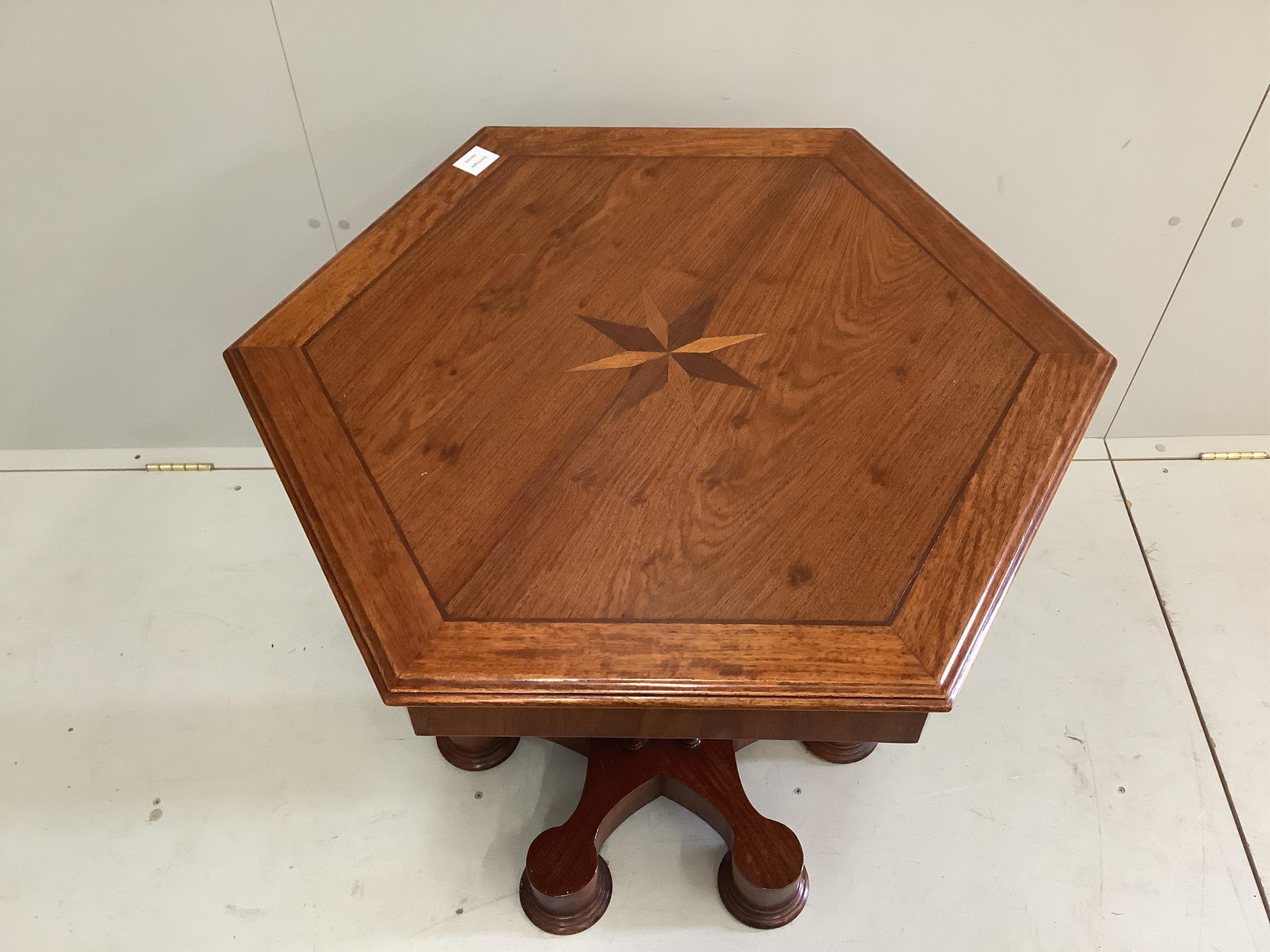 A Gothic style mahogany parquetry inlaid hexagonal centre table, width 81cm, height 75cm. Condition - fair